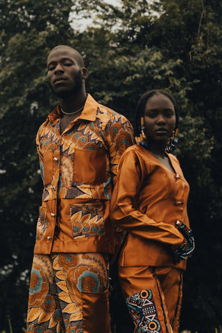 man and women dressed in african-inspired clothing