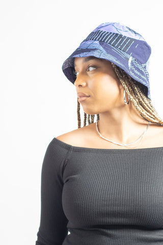 african print bucket hat made with ankara fabric in purple and black